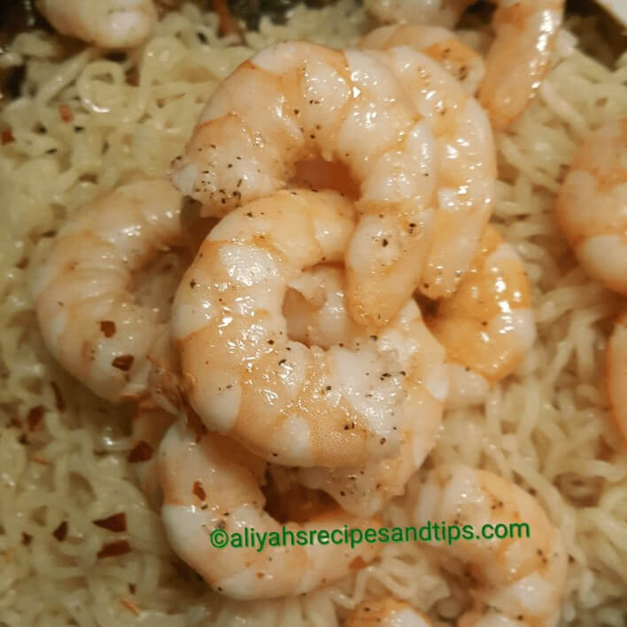 Remove the shrimps, red pepper flake, and noodles. Combine and allow to warm up. Check the season and readjust if necessary.